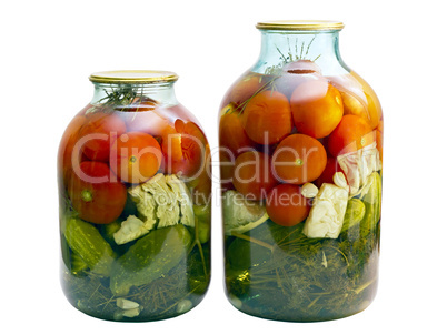 canned tomatoes and cucumbers in a glass jar