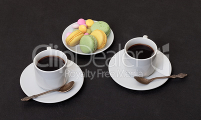 Two cups coffee and macaroon