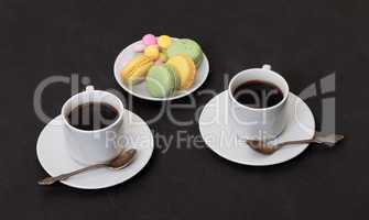 Two cups coffee and macaroon