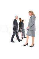 businessmen and businesswomen walking in different directions