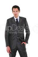 businessman standing with hand in pocket