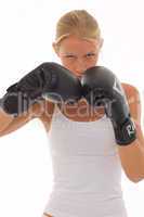 portrait of a young caucasian woman who does kick boxing with bo