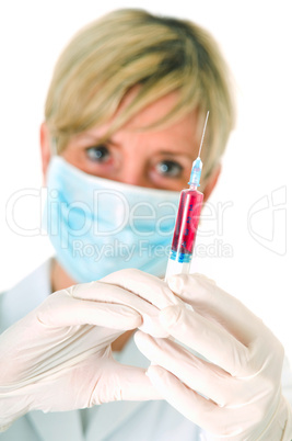 female doctor with mask holding a syringe