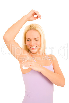 woman applying deodorant under her armpits