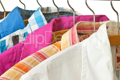 Upper shirts on a clothes rail