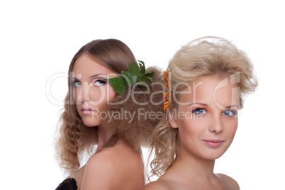 Two young woman with flower hair style