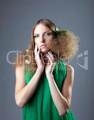 Russian girl with leaves and camomile in hair