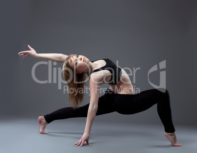 young high skill acrobat posing in dance