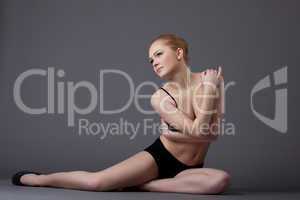 young gymnast girl in black top look at light