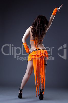 Beauty girl dance in orange go-go costume