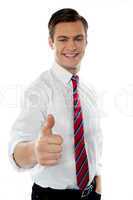 Business executive with thumbs up gesture