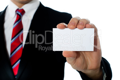Closeup shot of a man showing business card