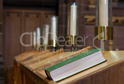 Bible on wooden bench in church