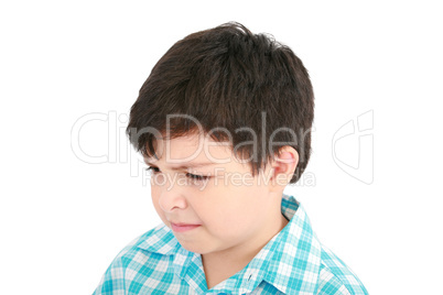 Adorable small boy looking at the viewer in a pensive mood.
