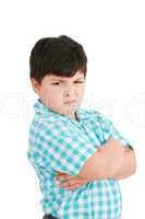 serious little boy with hands folded standing isolated on white