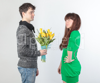 happy young couple with bouquet flowers