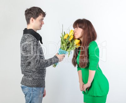 happy young couple with bouquet flowers happy young couple with bouquet flowers