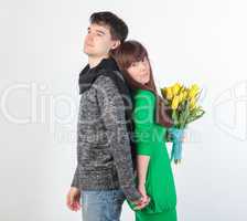 happy young couple with bouquet flowers