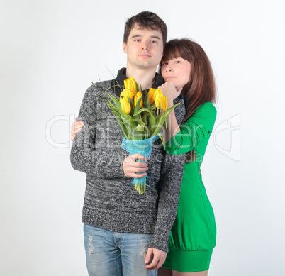 happy young couple with bouquet flowers happy young couple with bouquet flowers