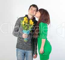 happy young couple with bouquet flowers