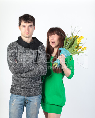 happy young couple with bouquet flowers