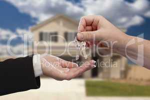 Handing Over the House Keys in Front of New Home