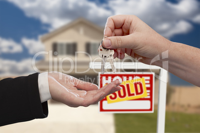 Handing Over the House Keys in Front of Sold New Home