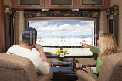 Couple Enjoy Beach View From RV
