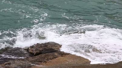 Sea waves on the rocky beach