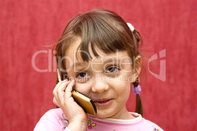 The girl speaks by phone