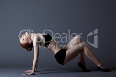 young gymnast girl posing in black top