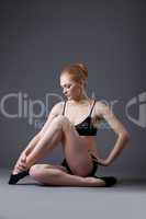 Beauty gymnast girl in black top relax