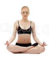Cute blond girl sit in yoga lotos asana pose