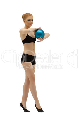 Young gymnast dance with ball in black