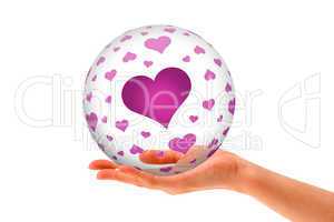 Hand holding a  Love 3D Sphere