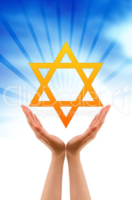 Hand holding a Jewish Star