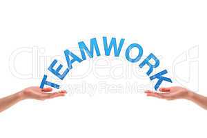 Hands holding the word teamwork