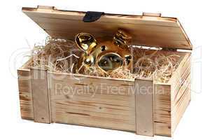 piggybank in wooden box with wood-wool