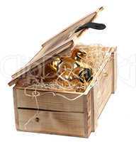 golden piggybank in box with wood-wool