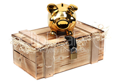 golden piggybank on wooden case locked with padlock