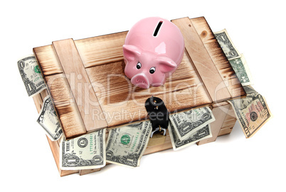 wooden case with dollar notes and pink piggybank