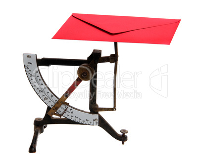 letter scales with red envelope