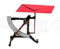 letter scales with red envelope
