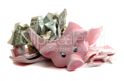 broken piggybank with dollar notes