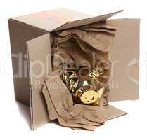 cardboard box with brown paper and golden piggybank