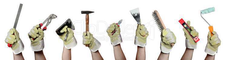 concept of tools in hands with gloves