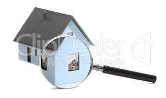 house behind a magnifying glass
