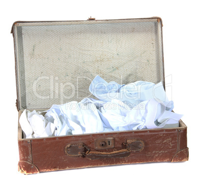 antiquarian brown suitcase with shirts