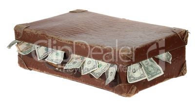 old brown suitcase with dollars