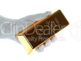 gold bar in hand with white glove
